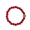 Onze handgemaakte kralenarmband met levensboom en rode acryl kralen